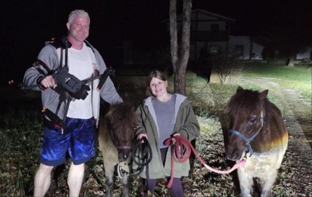 Brandon Akers with his thermal drone and two ponies found after they got loose
